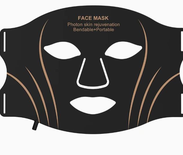 Black LED face mask laid flat, showing its bendable portable shape