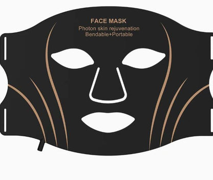 Black LED face mask laid flat, showing its bendable portable shape