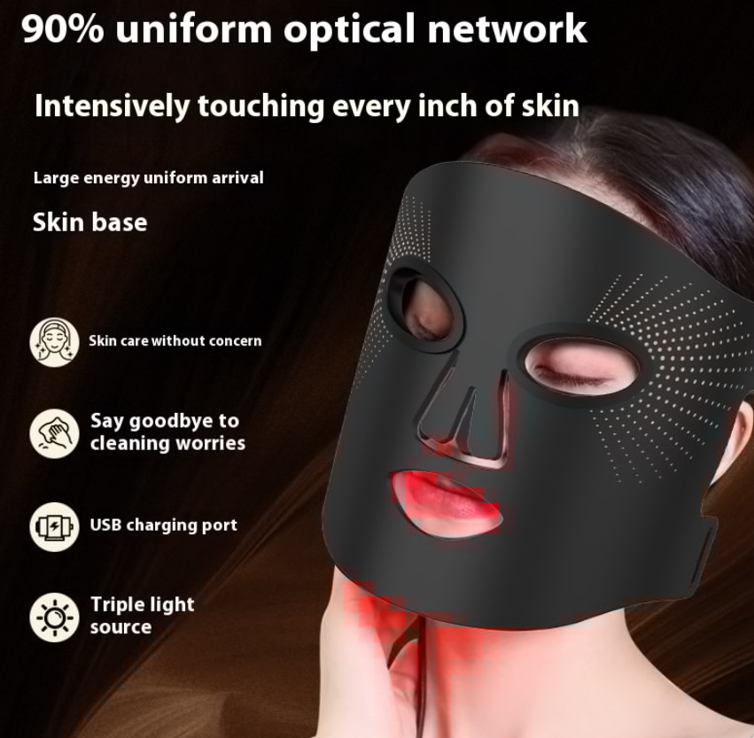 Woman wearing the black LED face mask, lit in red