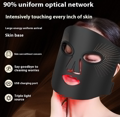 Woman wearing the black LED face mask, lit in red