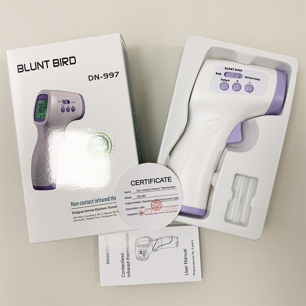 Infrared forehead thermometer being used on a child